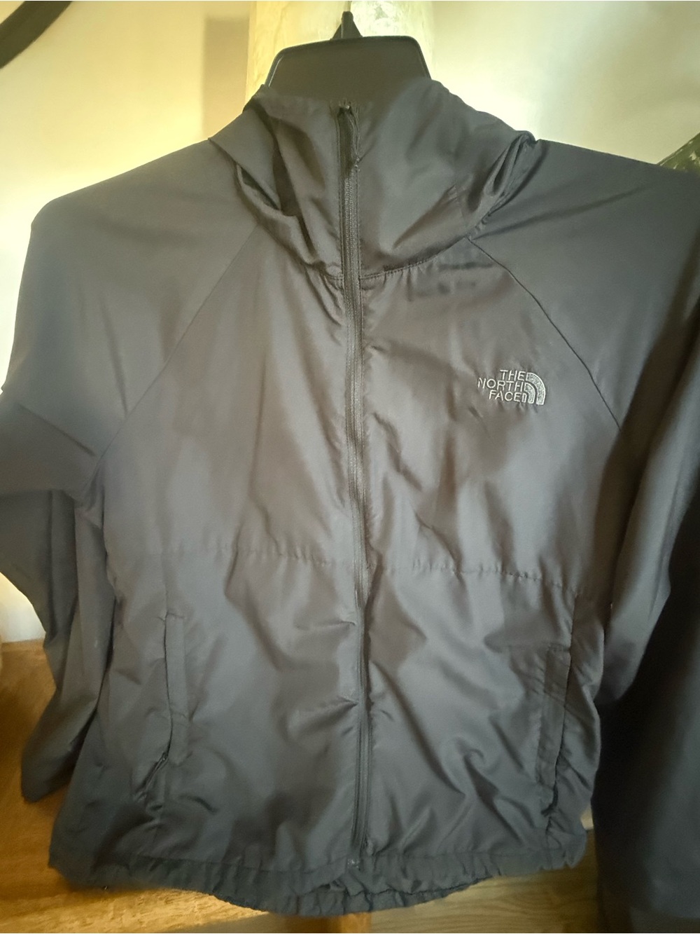 The North Face women’s  Black Full-Zip Windbreaker Jacket